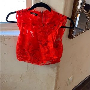 Bebe orange crop top. Lace detailing.